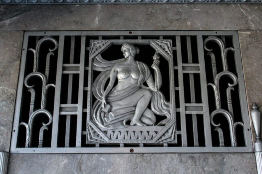 Bare-breasted woman sculpted out of metal found in the entrance to the Frist building