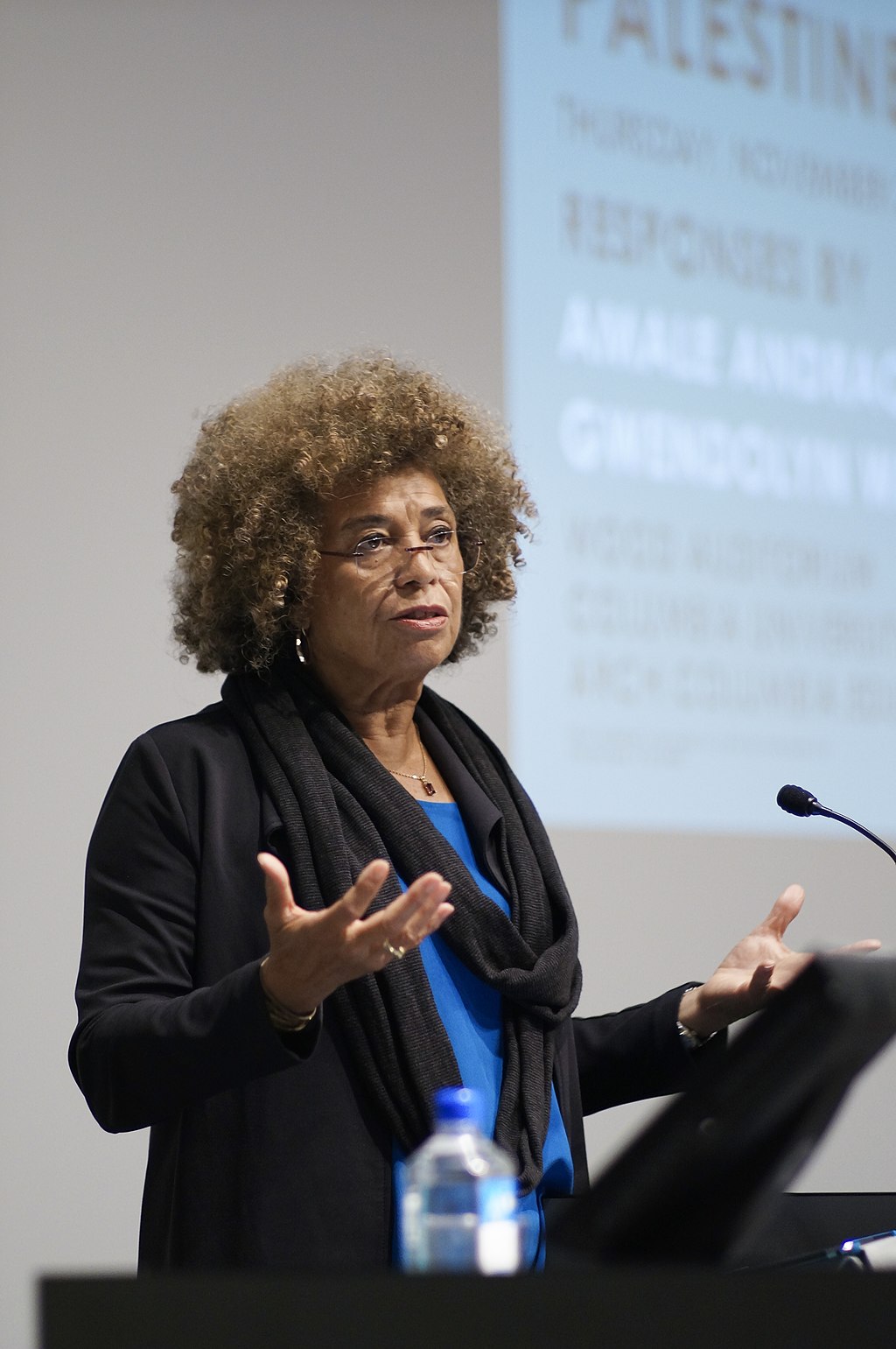 Woman speaking at a podium