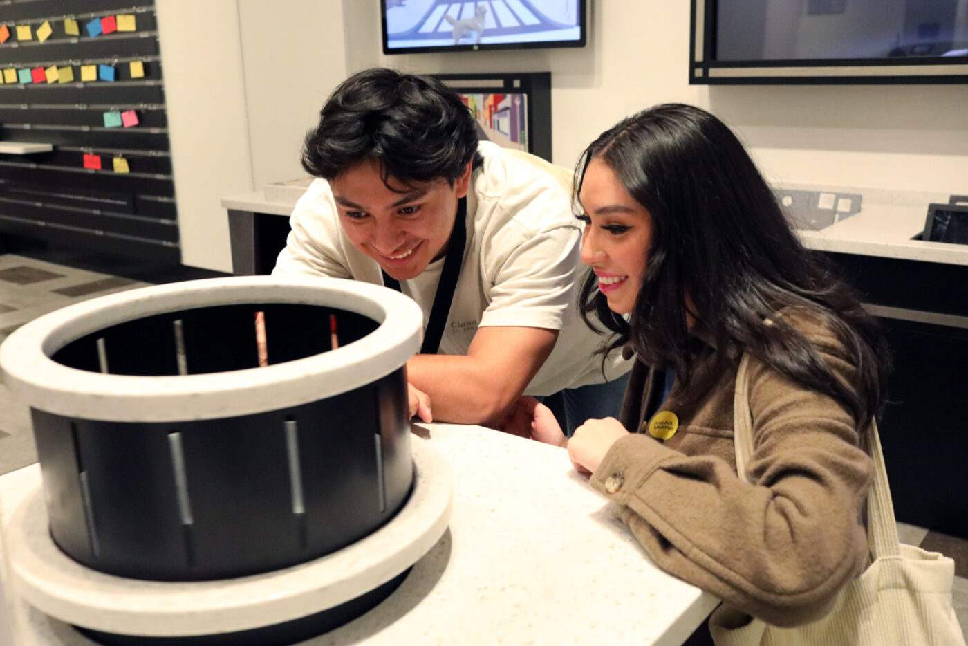 Two teens working at the zoetrope station in ArtQuest