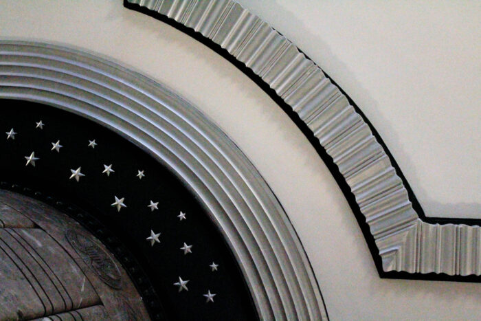 Curved details in the ceiling with silver star accents