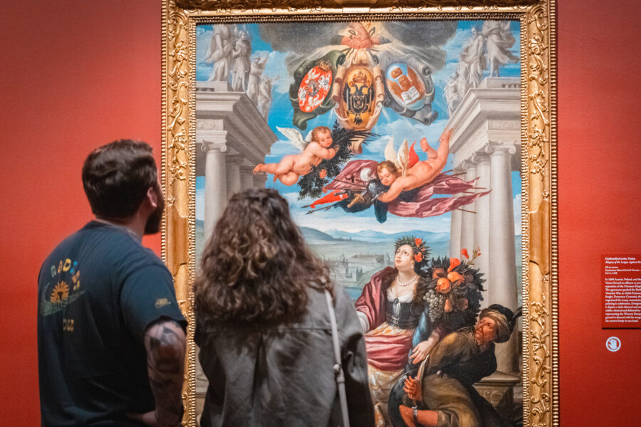 Couple looking at a large painting