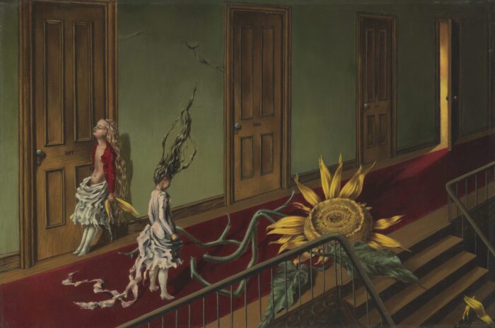 Two girls move through a corridor with a sunflower.