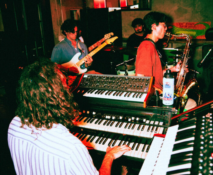 Band members have a jam session in a recording studio