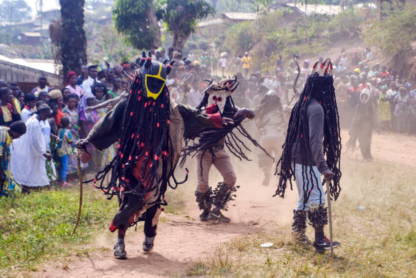 Hervé Youmbi, Bamiléké-Kwele Ku'ngang Gorilla Mask and Single-faced Rhino Mask, during a ceremony in Fondanti village.