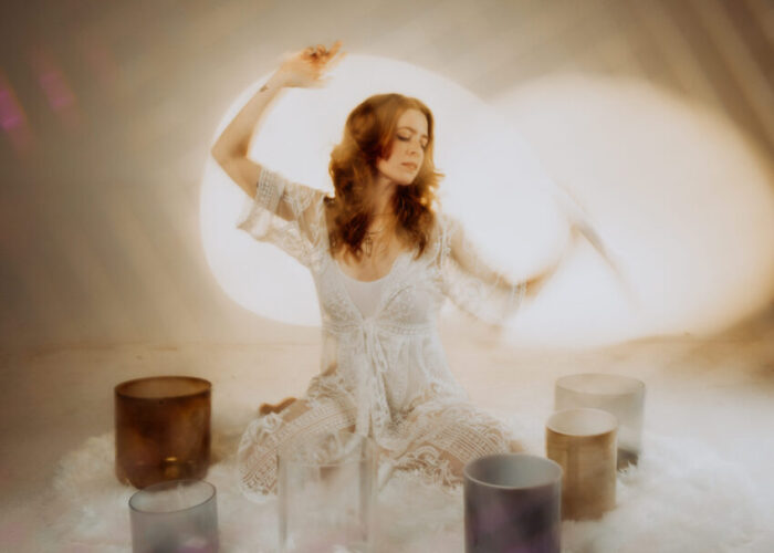 Kayce Laine poses with jars and vases.