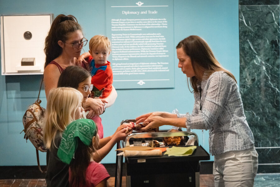 Docent talking with a family