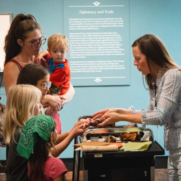Docent talking with a family