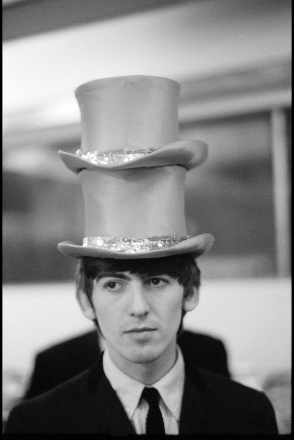 George, London, 1st January 1964, wearing two top hats at the Christmas Show 