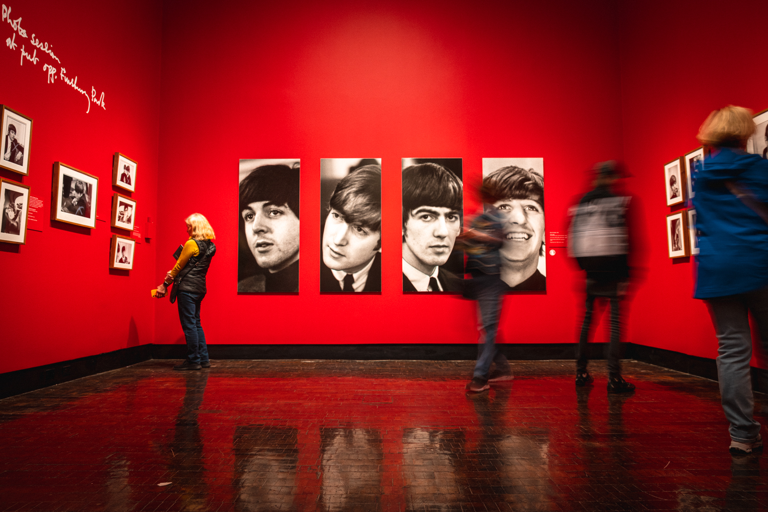 Guests walking through the Paul McCartney photographs exhibition