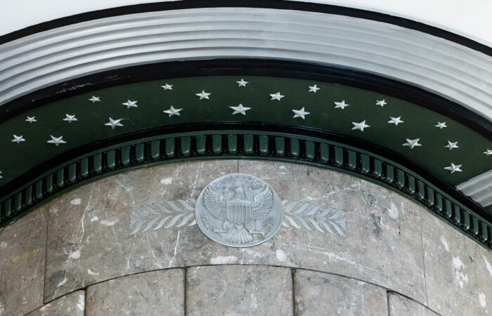 Close up of an archway with green trim and silver stars.