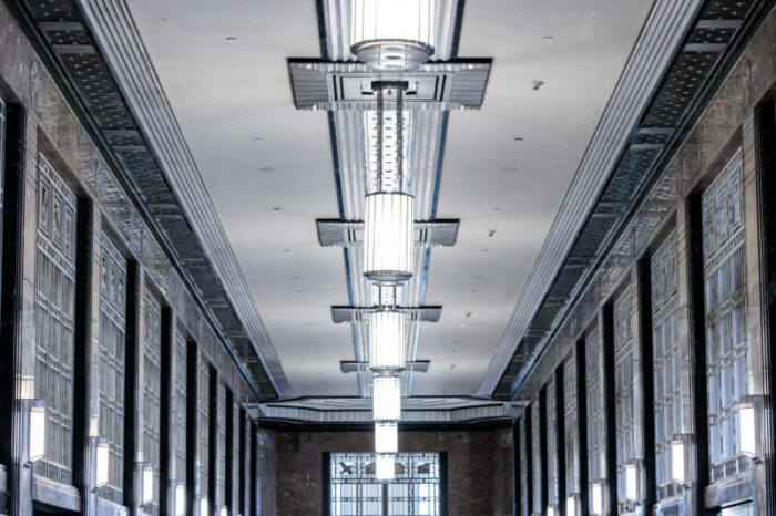 A series of Art Deco chandelier in a hallway.
