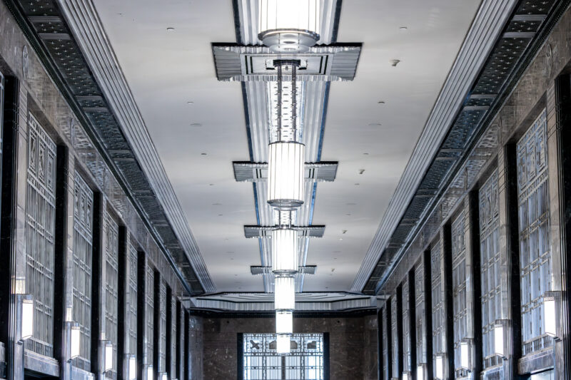 A series of Art Deco chandelier in a hallway.