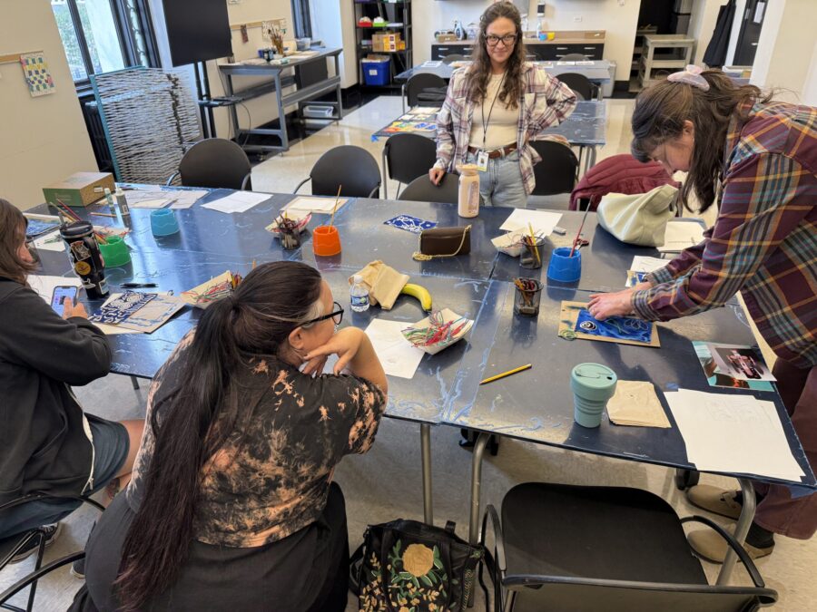 A group of people work on an art project together.