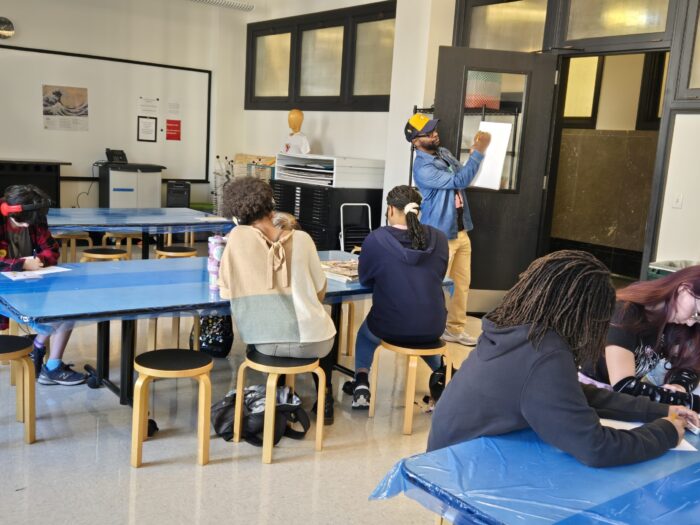 Teens participate in an art class.