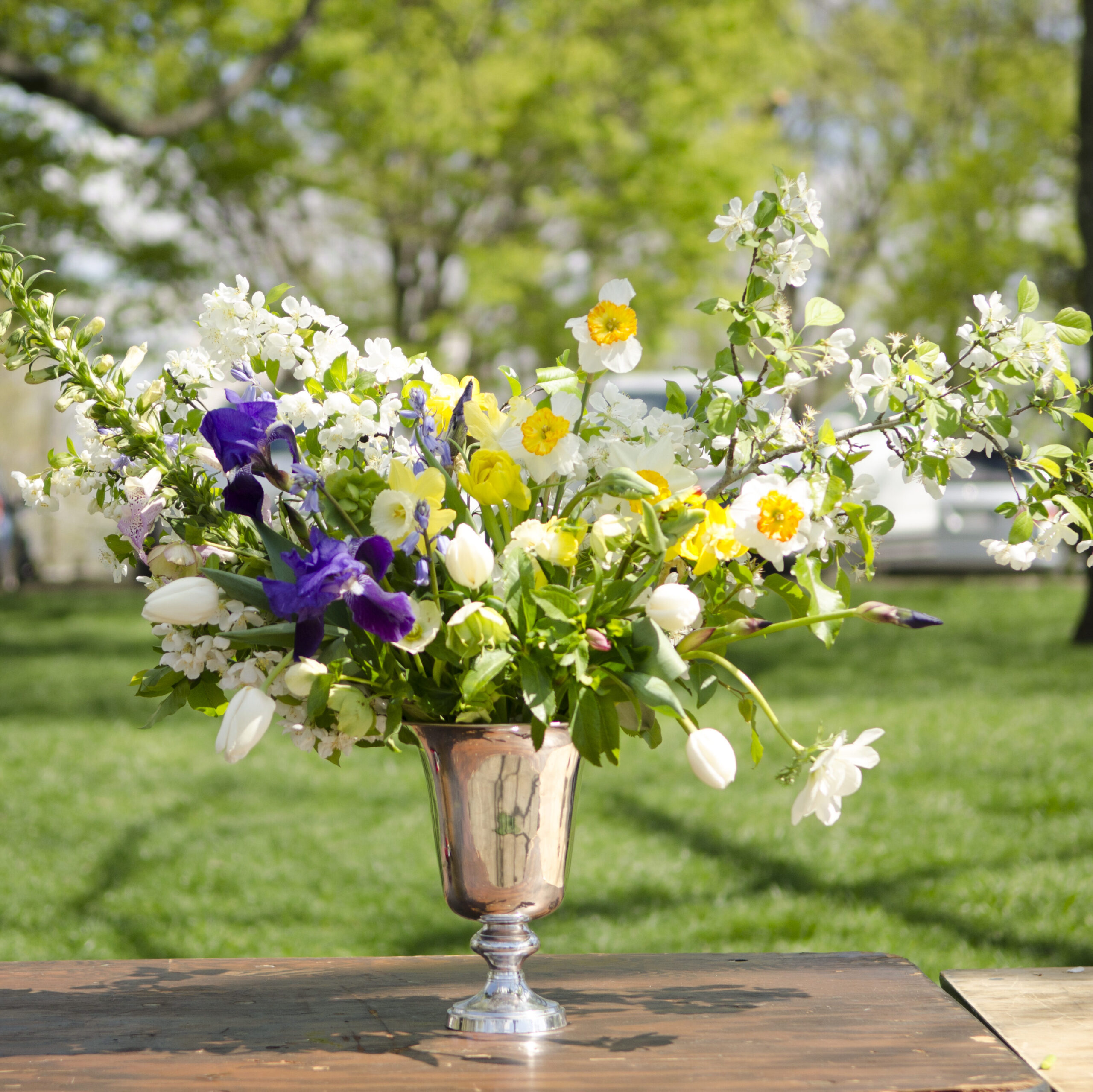 Floral arrangement in a metal vase.
