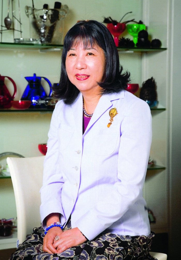 Photo of chef Tsukiko Hattori in a modern dinning room. 