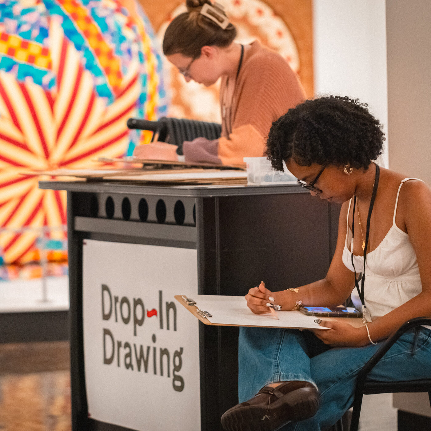 Woman sketching on a pad