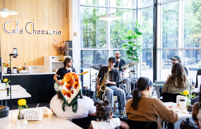 A jazz band performs in a cafe.