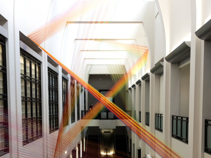 threads of various bright colors zigzagging across the Frist artrium.