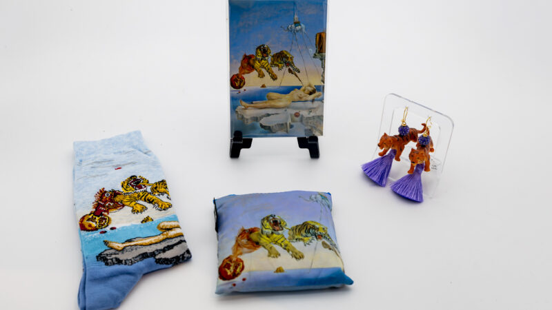 A group of accessories with a surreal tiger scene.