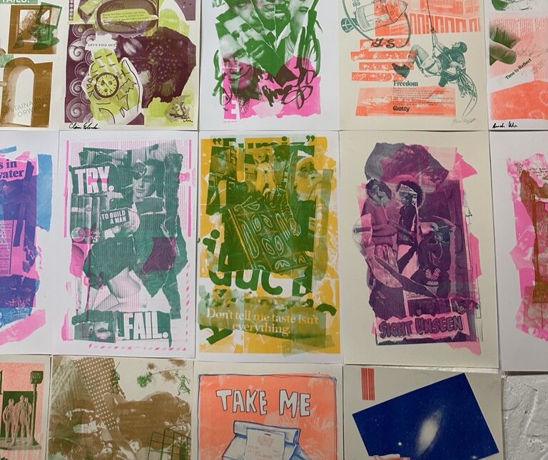 A series of colorful prints on a wall.