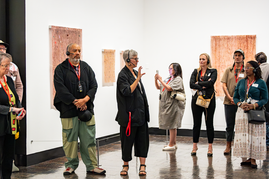 Tour guides explain about contemporary exhibition at an arts museum.