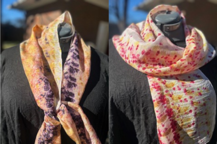Two black mannequins show off two different hand-dyed scarves.