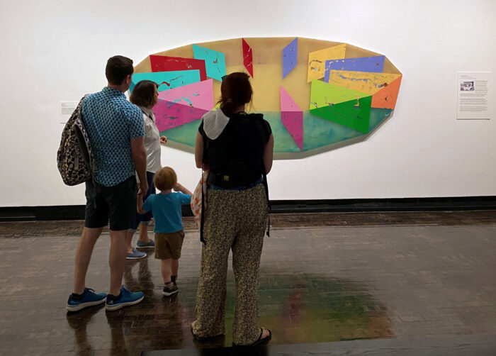 Family looking at a colorful work