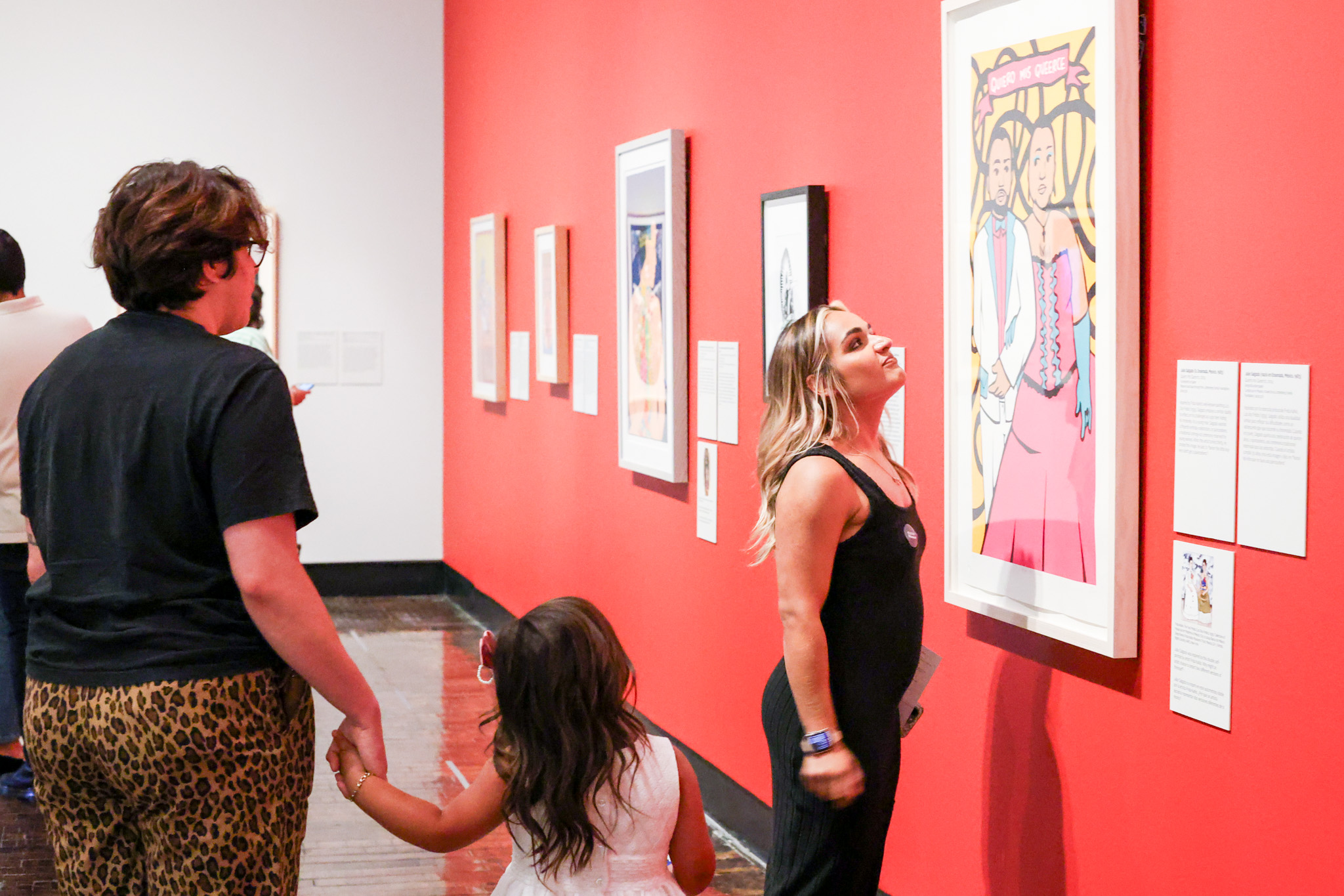 Family looking at art in a gallery