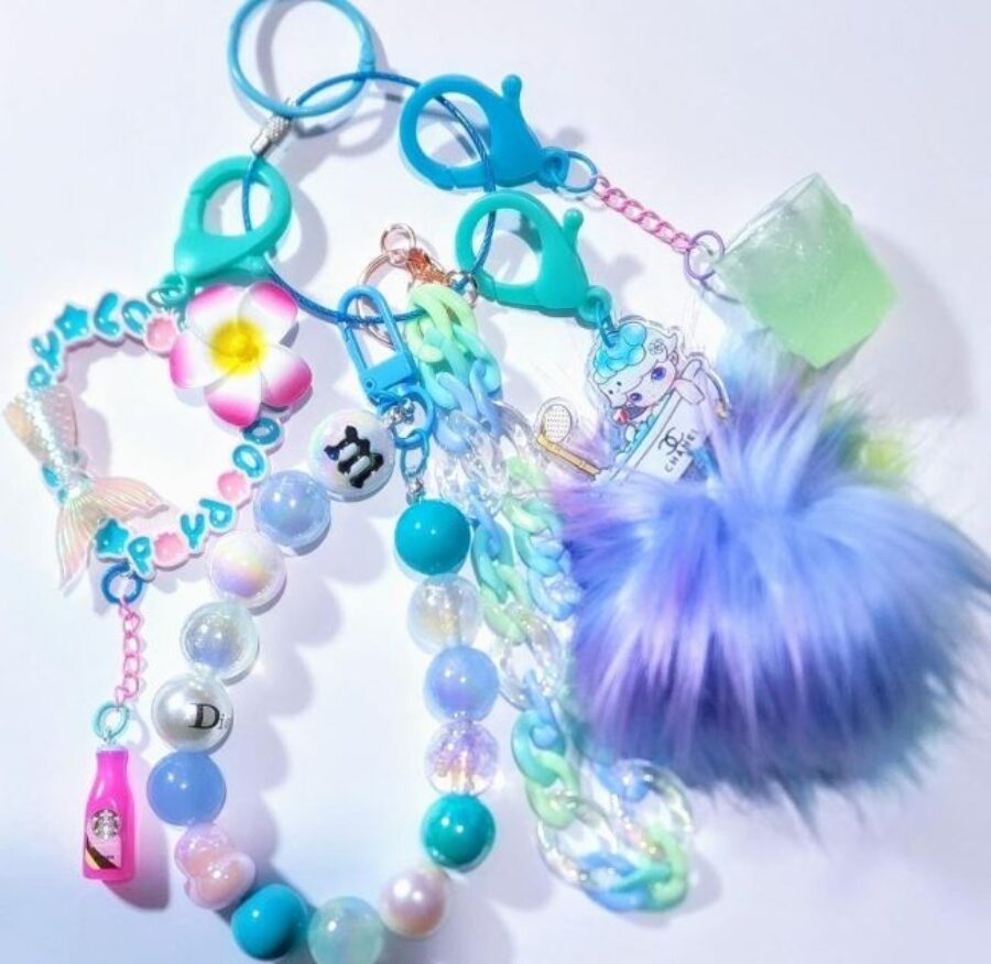 Charms made with colorful beads, trinkets, and feathers