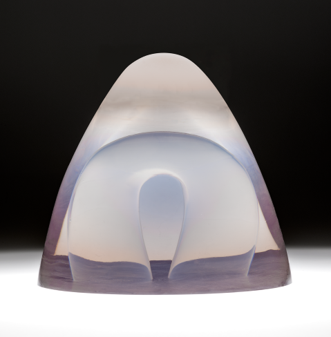 Cone-shaped, transparent, purple-hued resin object with an upside-down horseshoe resin figure inside.