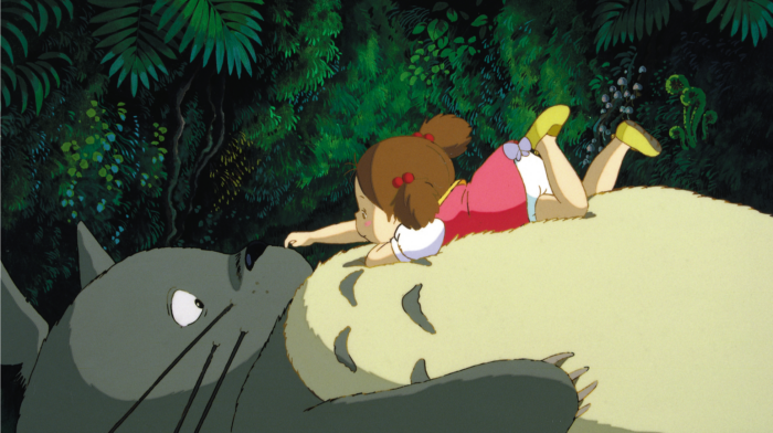 Animation of a big cat laying on its back with a small girl in a pink dress laying on the cat's stomach.