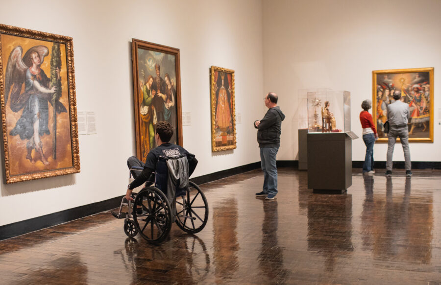 Visitors looking at art in the galleries