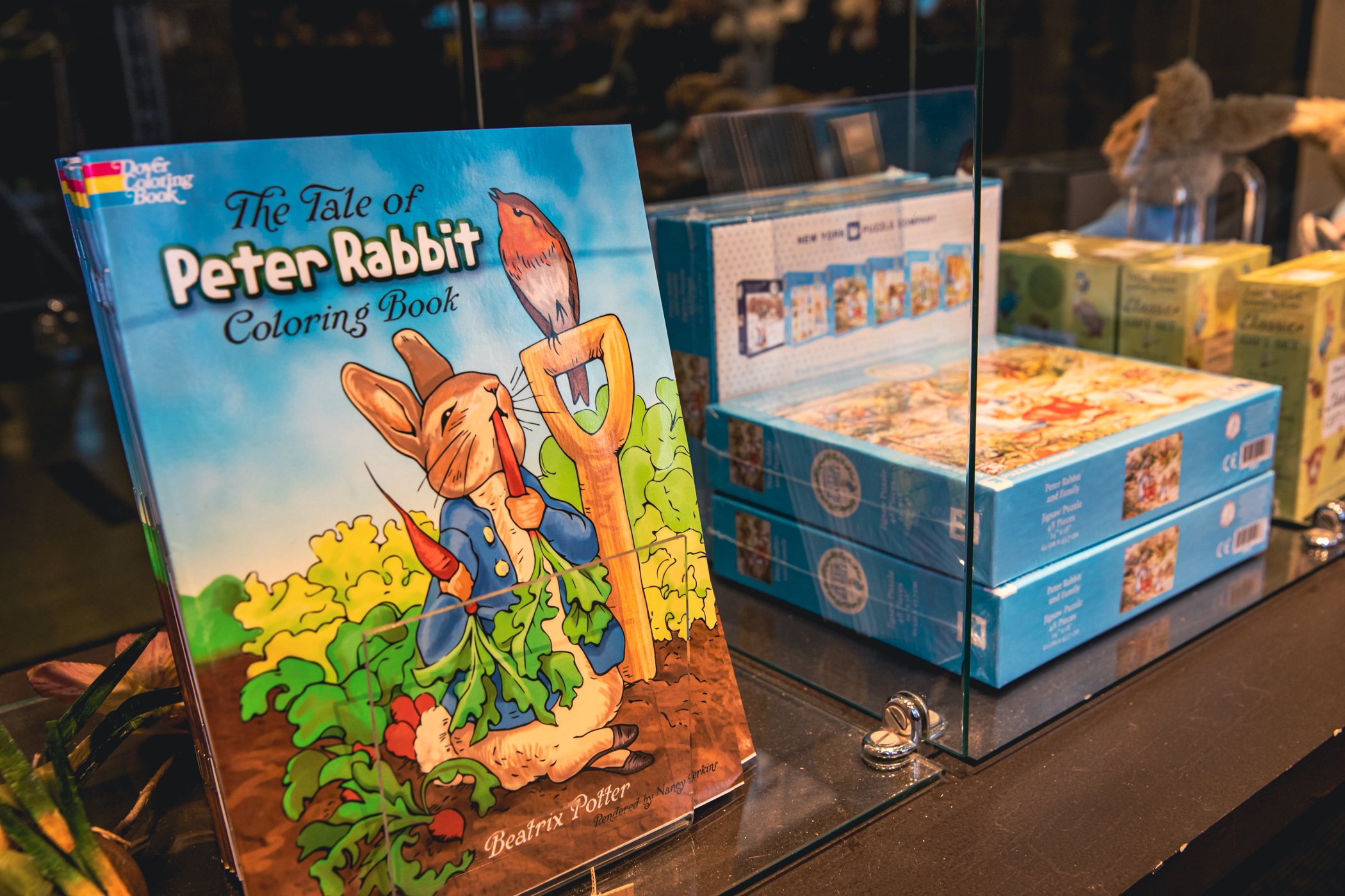 The Tale of Peter Rabbit coloring book propped up on a shelf