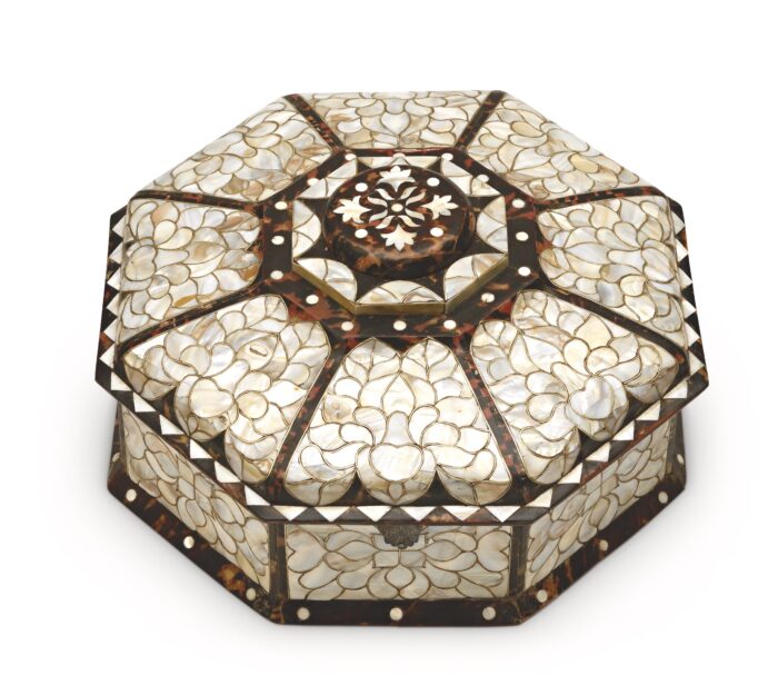 Ornate octagonal box made of pearl colored pieces and wood