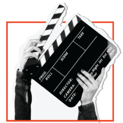 Two hands holding a clapperboard
