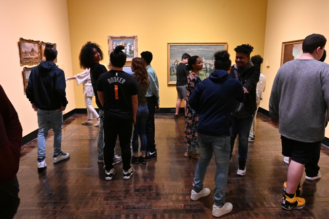 Group of teens looking at art in the gallery