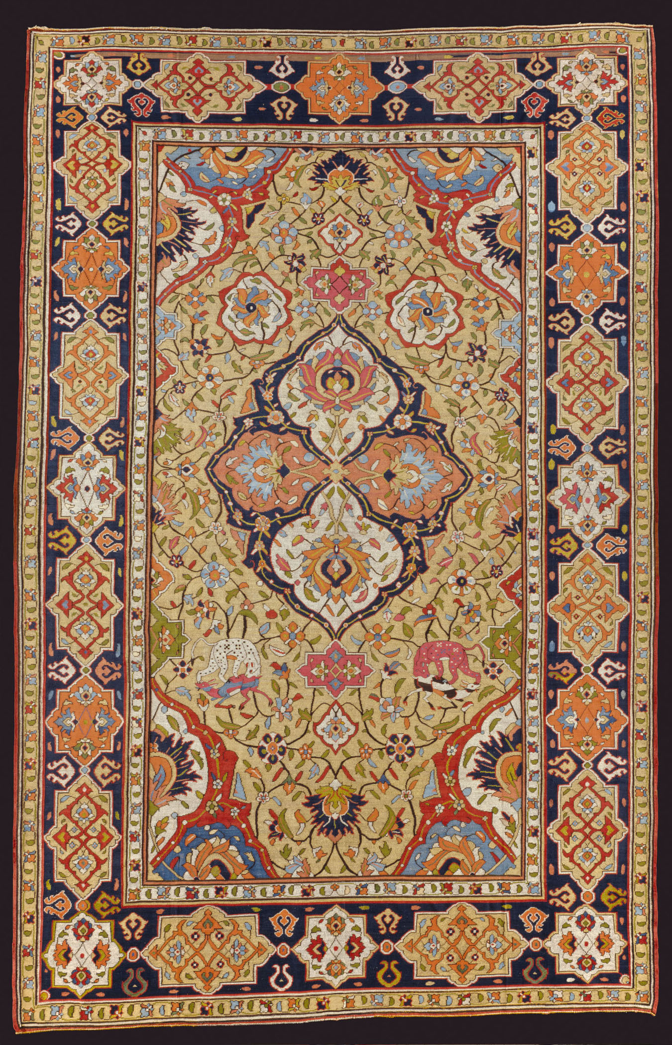 A rectangular multi-colored rug with an intricate medallion design.