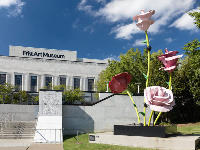 Large sculpture of a flower with light and dark pink blooms